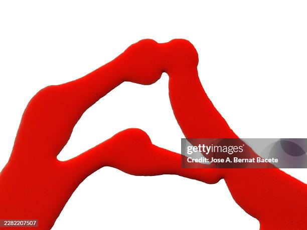 rivers of red paint slide down a white canvas. - sauce splatter stock pictures, royalty-free photos & images