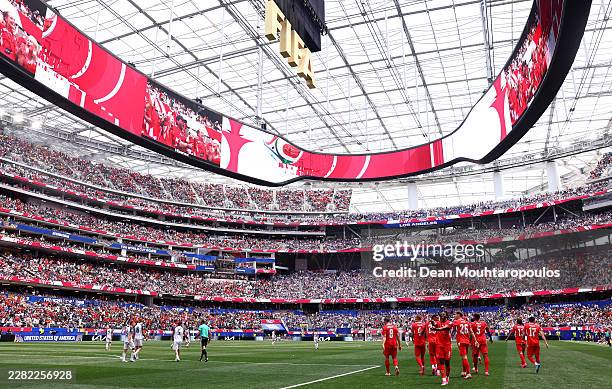 Johan Manzambi of Switzerland celebrates with teammates after scoring the team's third goal during the FIFA World Cup 2026 Group B match between...