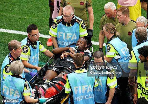Ismael Kone of Canada is stretched off after being fouled by Assim Madibo of Qatar during the FIFA World Cup 2026 Group B match between Canada and...