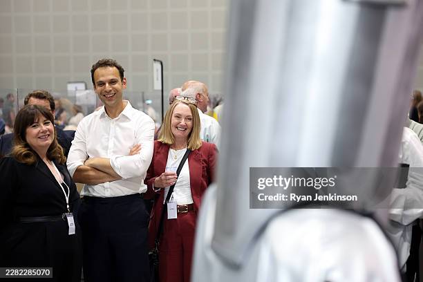 Former Makerfield MP Josh Simons watches Count Binface be interviewed at the By-election declaration at The Edge where votes were being counted on...