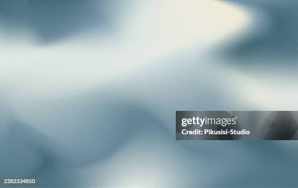 abstract pale blue and metallic silver grainy gradient background, modern soft grey fluid blurred background with a noisy texture - dramatic spotlight stock illustrations