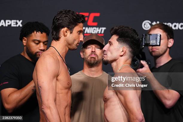 Allan Nascimento of Brazil and Mitch Raposo face off during the UFC Fight Night official weigh-ins at Meta APEX on June 19, 2026 in Las Vegas, Nevada.