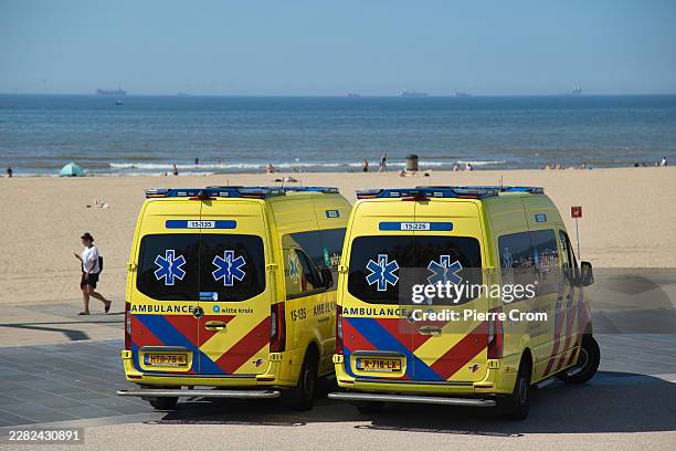 Ambulances are on standby along the beach in Scheveningen during a hot summer day on June 23, 2026 in The Hague, Netherlands. Dutch authorities have...
