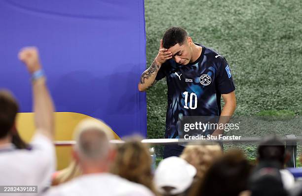 Miguel Almiron of Paraguay reacts after receiving a red card for covering his mouth while talking to another player during the FIFA World Cup 2026...