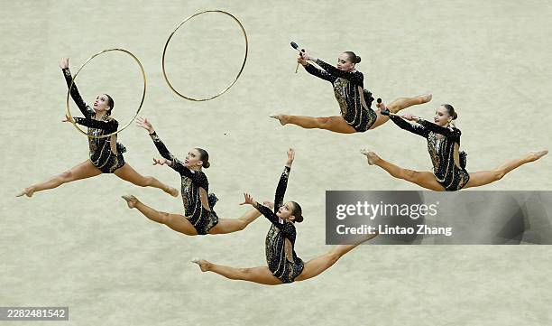 Team of Russia competes in the Group 3 Hoops & 2 Clubs Qualifications during day two of the FIG World Challenge Cup at Beijing Indoor Stadium on June...
