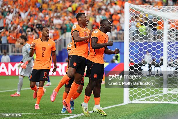 Brian Brobbey of the Netherlands celebrates with teammates after scoring his team's first goal during the FIFA World Cup 2026 Group F match between...