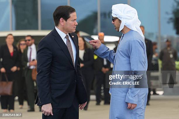 Secretary of State Marco Rubio talks to UAE Foreign Minister Sheikh Abdullah bin Zayed Al-Nahyan before boarding a US Air Force aircraft at Al-Bateen...