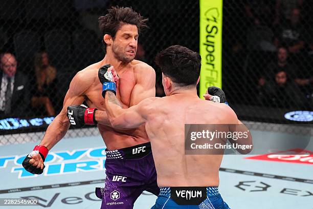 Mitch Raposo upnches Allan Nascimento of Brazil in a flyweight fight during the UFC Fight Night event at Meta APEX on June 20, 2026 in Las Vegas,...