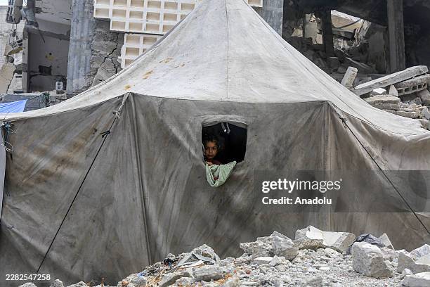 Palestinians continue their daily lives amid widespread destruction caused by Israeli attacks in Khan Yunis, southern Gaza Strip, on June 24, 2026....