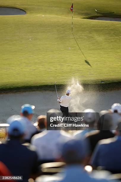 Sam Stevens of the United States plays a shot from a bunker on the 16th hole during the third round of the 126th U.S. OPEN at Shinnecock Hills Golf...
