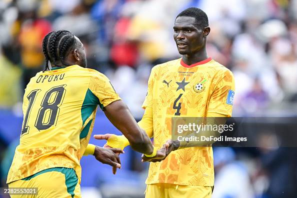 Opoku Jerome Opoku of Ghana and Jonas Adjetey of Ghana gestures during the ...