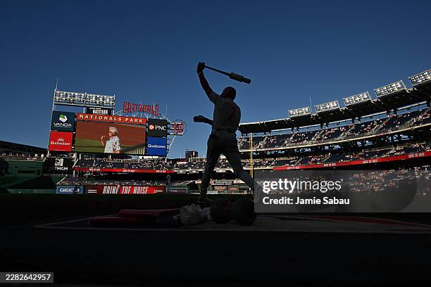 Trea Turner of the Philadelphia Phillies warms up before batting against the Washington Nationals in the first inning at Nationals Park on June 24,...