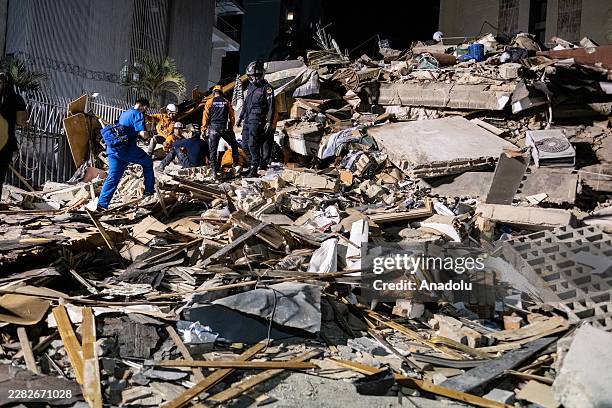 Rescue workers search through the rubble of a collapsed building following a powerful earthquake in Caracas, Venezuela, on June 24, 2026. Venezuela...