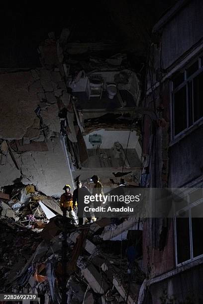 Rescue teams continue searching the rubble of a collapsed building for survivors in the San Bernardino neighborhood of Caracas, Venezuela, on June...