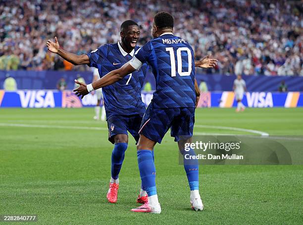 Kylian Mbappe of France celebrates with teammate Ousmane Dembele after scoring his team's second goal during the FIFA World Cup 2026 Group I match...
