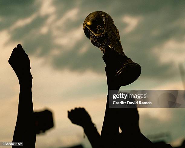 Colombia fans hold up a FIFA World Cup Trophy replica as they gather for a 'Banderazo' ahead of the FIFA World Cup 2026 Group K match between...