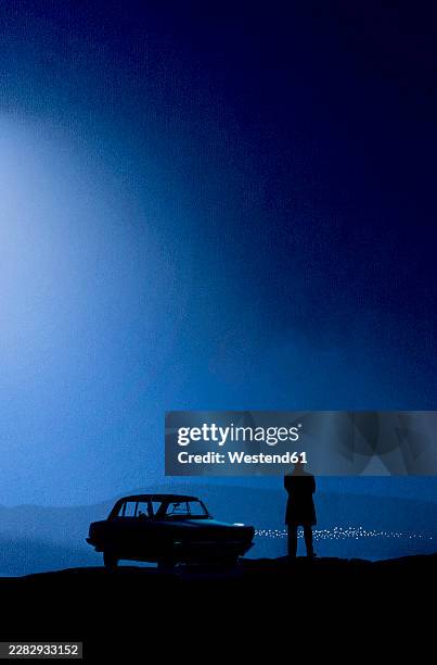 silhouette by car at night looking towards distant city - car reflection stock illustrations