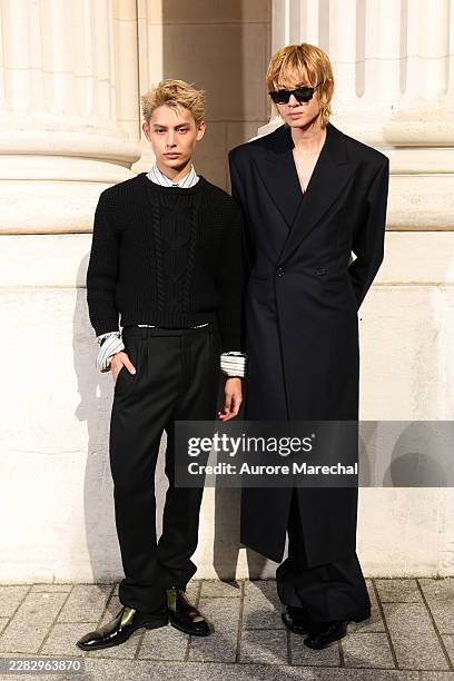 James Zhao and Martin Edwards attend the Saint Laurent Menswear Spring/Summer 2027 show as part of Paris Fashion Week on June 23, 2026 in Paris,...