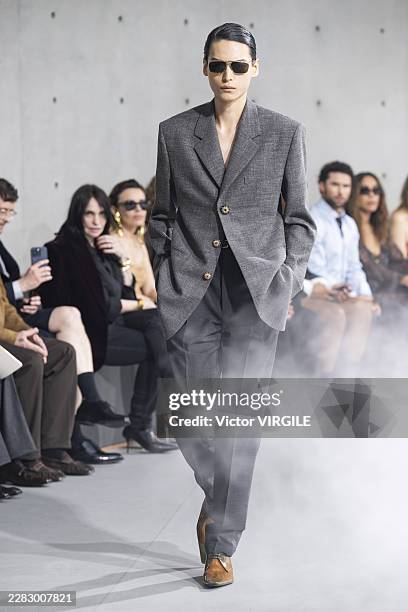 Model walks the runway during the Saint Laurent Menswear Spring/Summer 2027 fashion show as part of Paris Fashion Week on June 23, 2026 in Paris,...