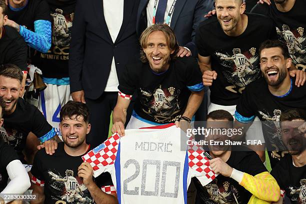 Luka Modric of Croatia celebrates with teammates after earning his 200th cap during the FIFA World Cup 2026 Group L match between Panama and Croatia...