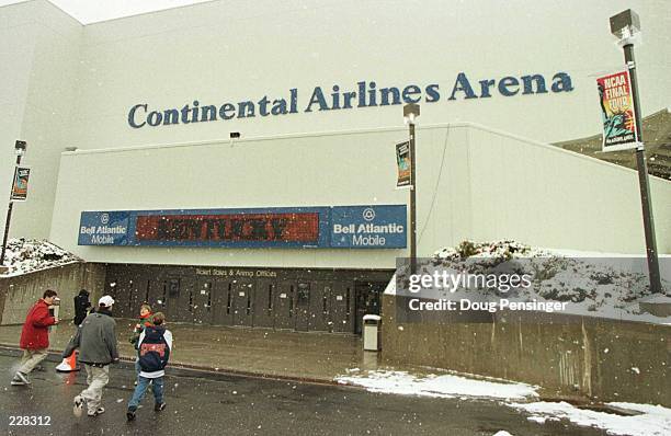 Basketball fans made their way through the spring snow to watch the final four teams in the NCAA Men''s Basketball Championships practice at the...