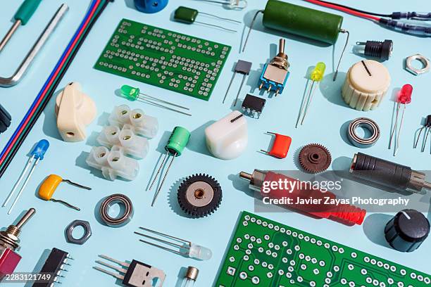 electronic components knolling on light blue background - toggle switch stock pictures, royalty-free photos & images