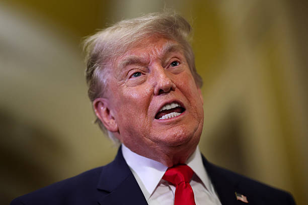 President Donald Trump speaks to the media as he departs after meeting with Republican senators at the U.S. Capitol on June 24, 2026 in Washington,...