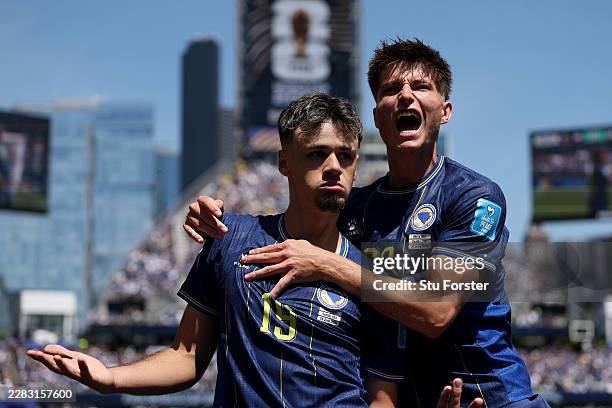 Kerim Alajbegovic of Bosnia and Herzegovina celebrates with Esmir Bajraktarevic after scoring the team's first goal during the FIFA World Cup 2026...