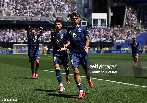 Kerim Alajbegovic of Bosnia and Herzegovina celebrates with Esmir Bajraktarevic after scoring the team's first goal during the FIFA World Cup 2026...