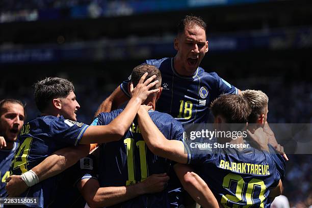 Bosnia and Herzegovina players celebrate after an own goal by Sultan Albrake of Qatar for the team’s second goal during the FIFA World Cup 2026 Group...