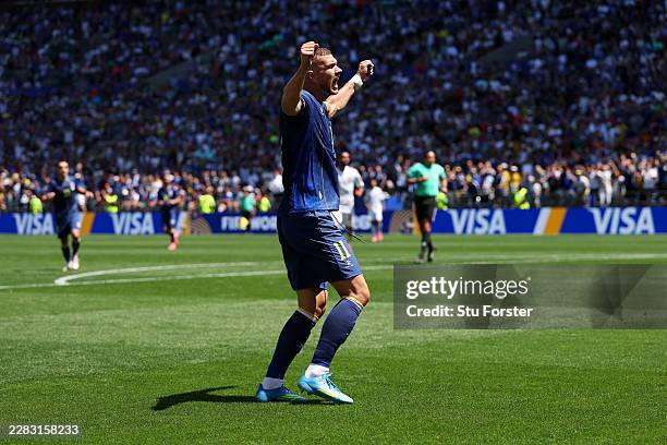 Edin Dzeko of Bosnia and Herzegovina celebrates after an own goal by Sultan Albrake of Qatar for the team’s second goal during the FIFA World Cup...