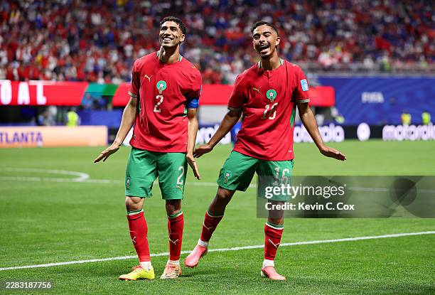 Gessime Yassine of Morocco celebrates with teammate Achraf Hakimi after scoring his team's fourth goal during the FIFA World Cup 2026 Group C match...