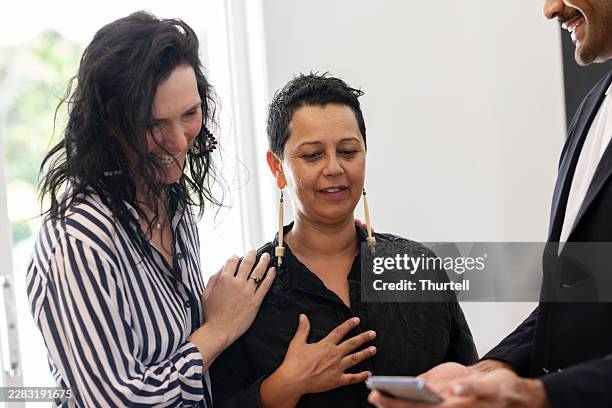 two women engaging in conversation with a man - one man only stock pictures, royalty-free photos & images