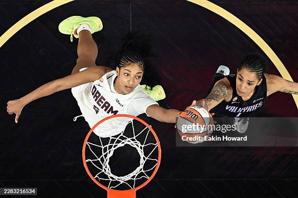 Gabby Williams of the Golden State Valkyries and Angel Reese of the Atlanta Dream reach for a rebound in the first quarter at Chase Center on June...