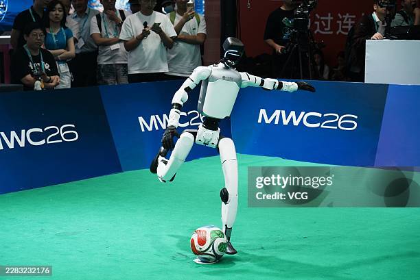 Humanoid robot takes part in the finals of a humanoid robot penalty kick competition during the 2026 Mobile World Congress Shanghai on June 25, 2026...
