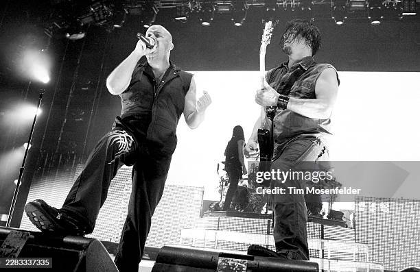 Dave Draiman and Dan Donegan of Disturbed perform during the Music as a Weapon Tour at Power Balance Pavilion on March 13, 2011 in Sacramento,...