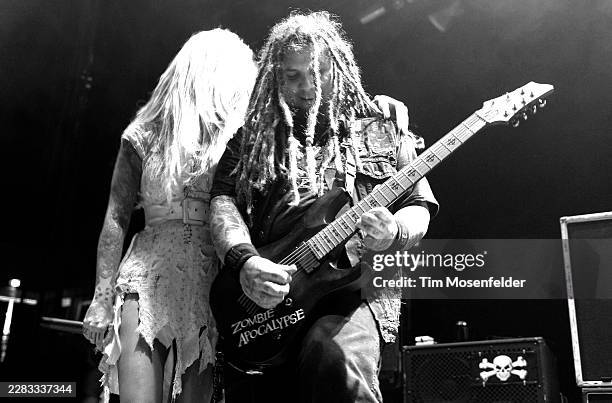 Maria Brink and Chris Howorth of In This Moment perform during the Music as a Weapon Tour at Power Balance Pavilion on March 13, 2011 in Sacramento,...