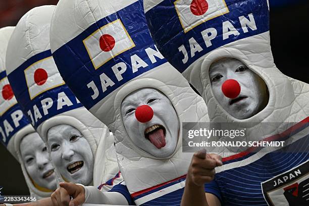 Japan's supporters pose ahead of the 2026 World Cup round of 32 football match between Brazil and Japan at the Houston Stadium in Houston on June 29,...