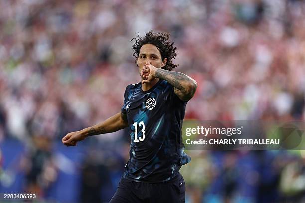 Paraguay's defender Jose Canale celebrates scoring a penalty kick to win the penalty shootout of the 2026 World Cup round of 32 football match...