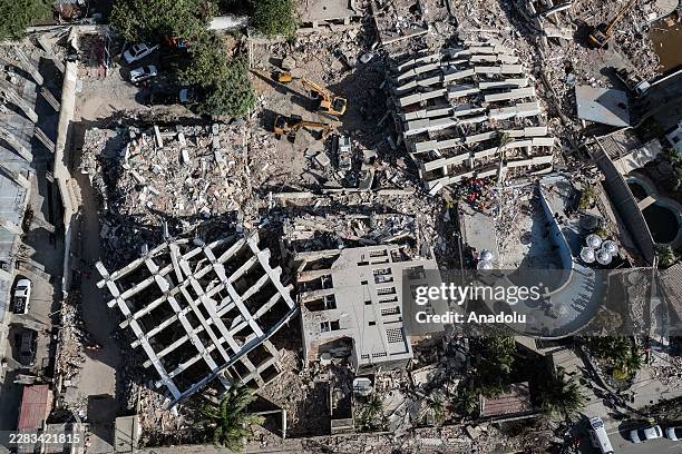 An aerial view shows collapsed buildings and debris in the Carabellada and Caribe neighborhoods following powerful earthquakes in La Guaira,...