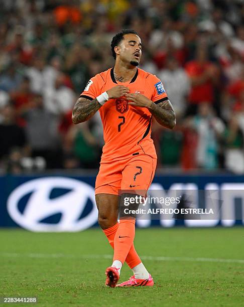 Netherlands' forward Justin Kluivert reacts after missing his penalty in the shootout during the 2026 World Cup round of 32 football match between...