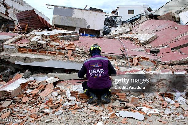Member of the Colombian brigade is seen as more than 1,600 specialists from 30 countries and 12 UN-coordinated rescue teams have arrived following...