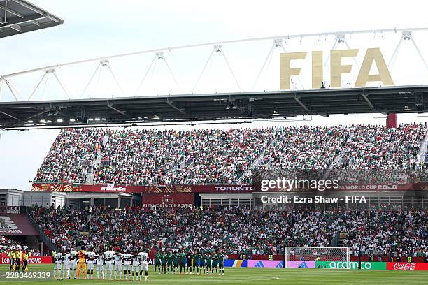 Players and match officials observe a minute of silence for the victims of the earthquake in Venezuela before the FIFA World Cup 2026 Group I match...