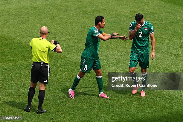 Rebin Ghareeb of Iraq is consoled by Ibrahim Bayesh of Iraq after receiving a red card by Referee Anthony Taylor after the VAR review during the FIFA...