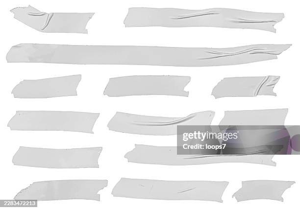 translucent white torn tape strips isolated on white background - glue texture stock illustrations