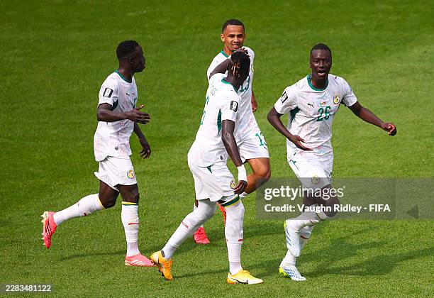 Pape Gueye of Senegal celebrates with teammates after scoring his team's fourth goal during the FIFA World Cup 2026 Group I match between Senegal and...