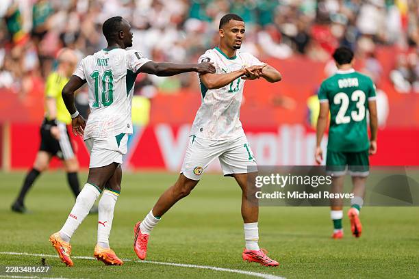 Iliman Ndiaye of Senegal celebrates with teammate Sadio Mane after scoring his team's fifth goal during the FIFA World Cup 2026 Group I match between...