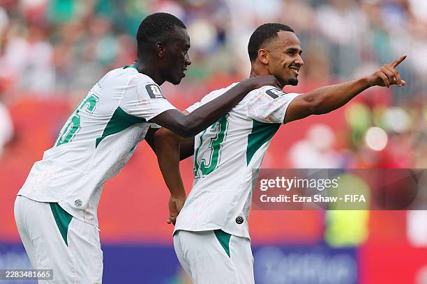 Iliman Ndiaye of Senegal celebrates with teammate Pape Gueye after scoring his team's fifth goal during the FIFA World Cup 2026 Group I match between...