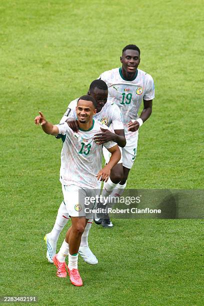 Iliman Ndiaye of Senegal celebrates with teammates Moussa Niakhate and Pape Gueye after scoring his team's fifth goal during the FIFA World Cup 2026...