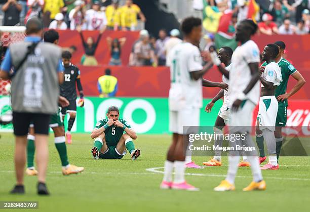 Akam Hashim of Iraq shows dejection after the team's 0-5 defeat and elimination from the tournament following the FIFA World Cup 2026 Group I match...
